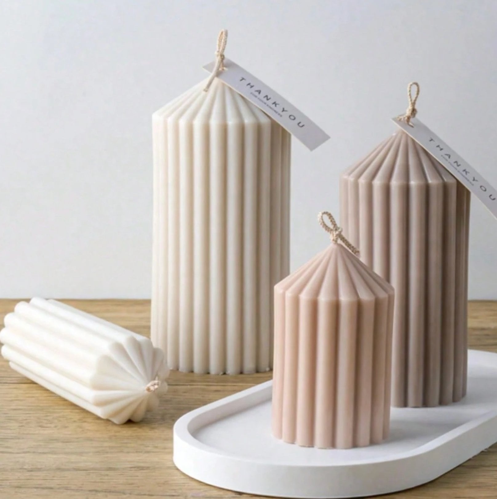 Fluted pillar candles with starburst tops, hand-poured in soy, beeswax and coconut wax